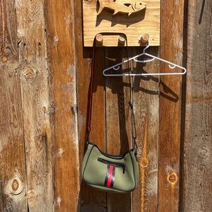 Stylish Green Crossbody Bag with Red Stripe